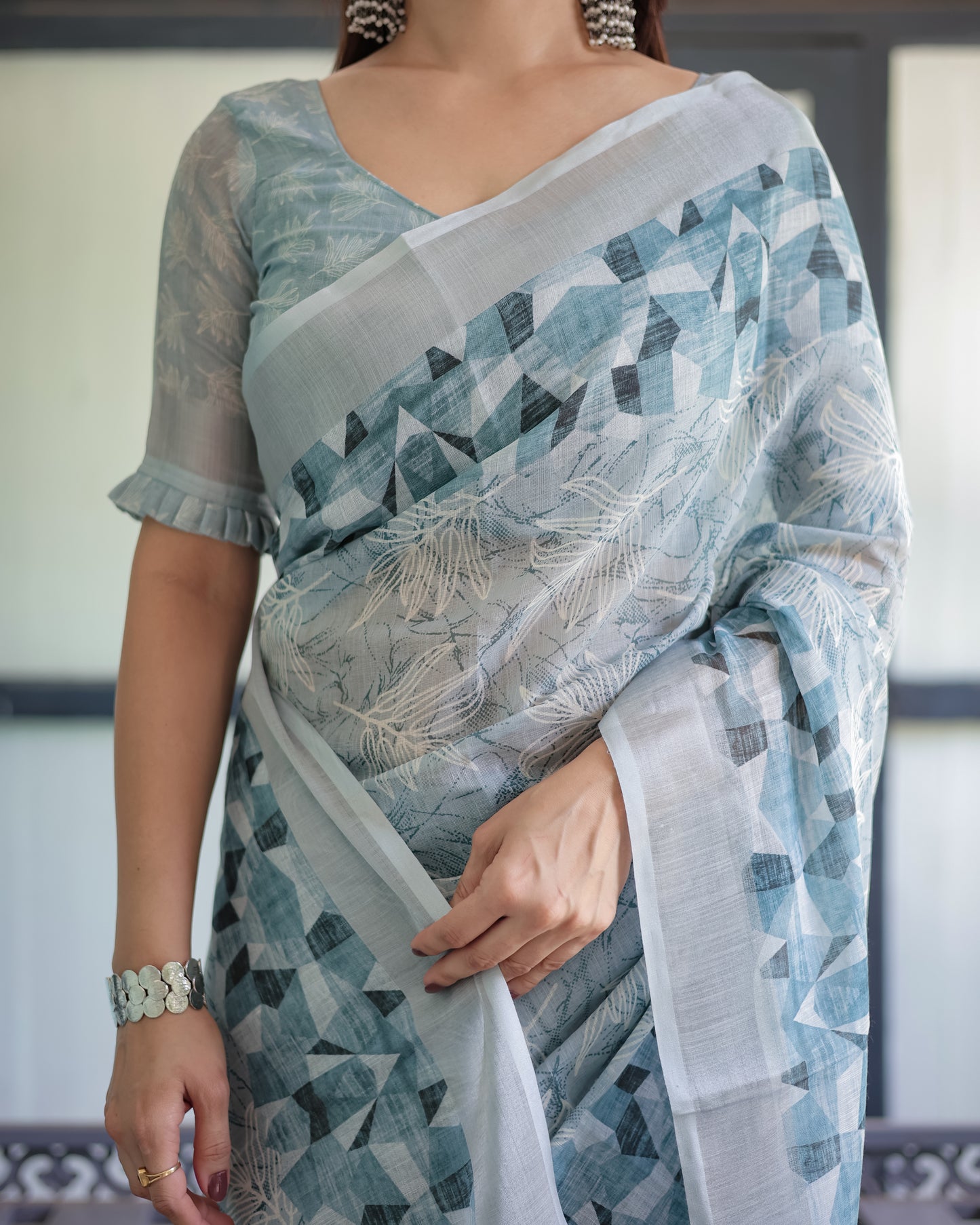 Pure Pastel Blue Linen With A Geometric Print & Delicate Floral Embroidery Saree