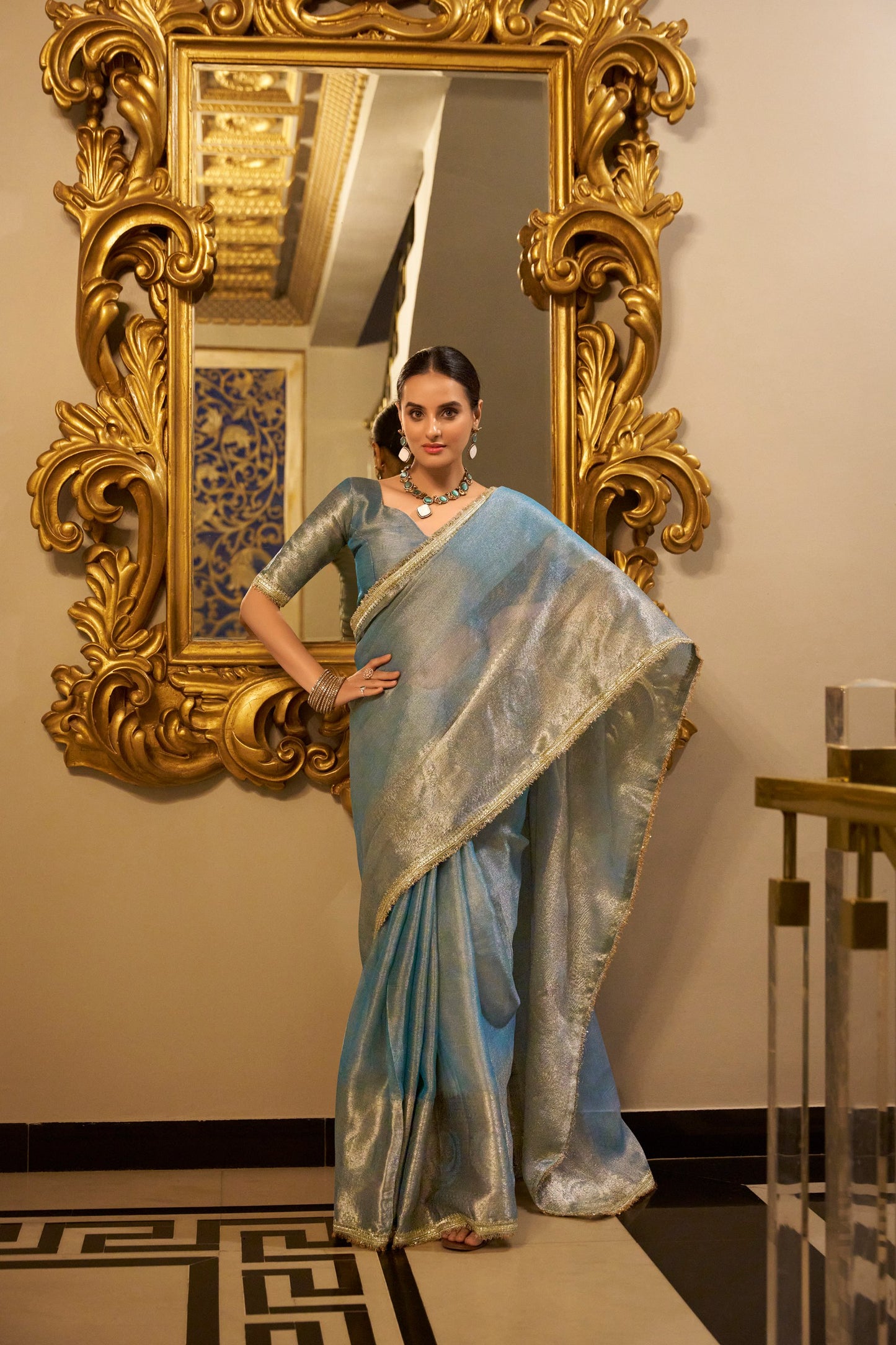 Tissue Shimmer Sky Blue Saree with Zari Weaving and Sequins Lace Border