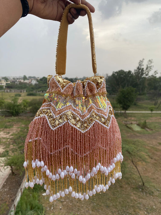 Hand Embroidered Bridal Potli Bag with Tassels and Pearl Handle – Festive Wedding Clutch for Women