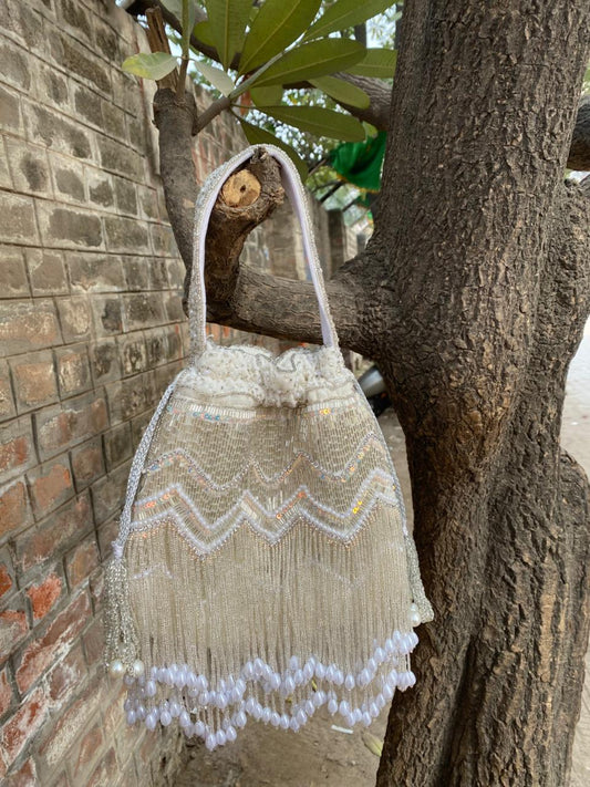 Hand Embroidered Bridal Potli Bag with Tassels and Pearl Handle – Festive Wedding Clutch for Women