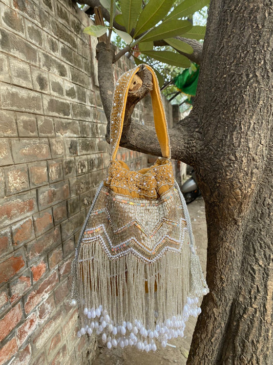 Hand Embroidered Bridal Potli Bag with Tassels and Pearl Handle – Festive Wedding Clutch for Women