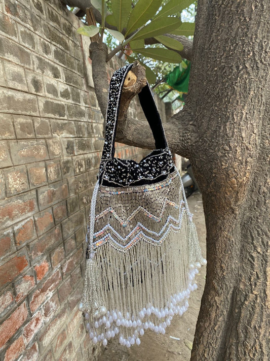 Hand Embroidered Bridal Potli Bag with Tassels and Pearl Handle – Festive Wedding Clutch for Women