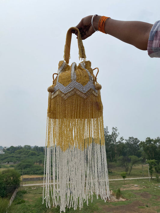 Yellow Hand Embroidered Bridal Potli Bag with Tassels and Pearl Handle – Festive Wedding Clutch for Women