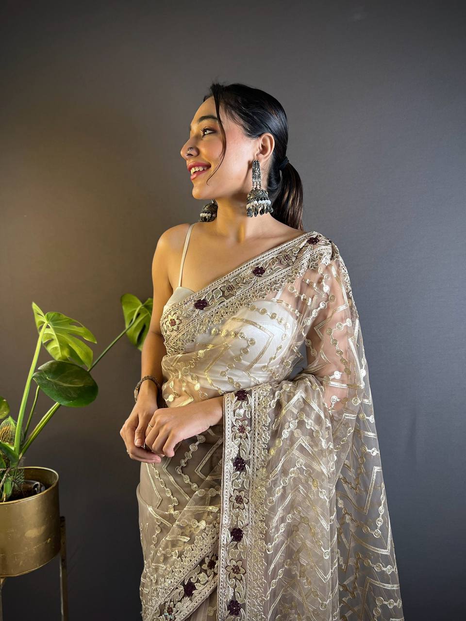 Cream Net Embellished Saree With Unstitched Blouse