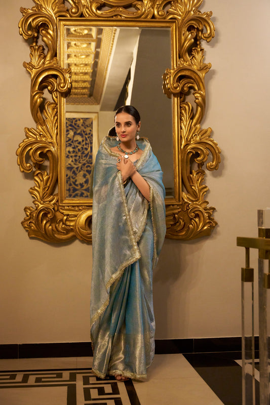 Tissue Shimmer Sky Blue Saree with Zari Weaving and Sequins Lace Border