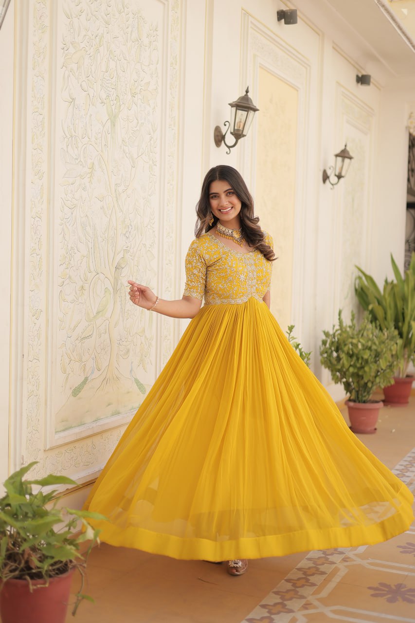 Yellow Color Faux Blooming Zari Sequence Embroidered Ethnic Gown By Stylish Ethnic